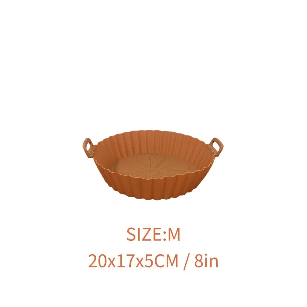 Mantén más limpia tu Air Fryer con el Molde de Silicona Reutilizable Linden™. Antiadherente, lavable, con asas y disponible en tamaños M y L.