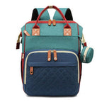 Organiza todo para tu bebé con la Mochila Pañalera Linden™: cambiador plegable, bolsillos térmicos, gran capacidad, separación húmedo/seco y diseño resistente al agua.