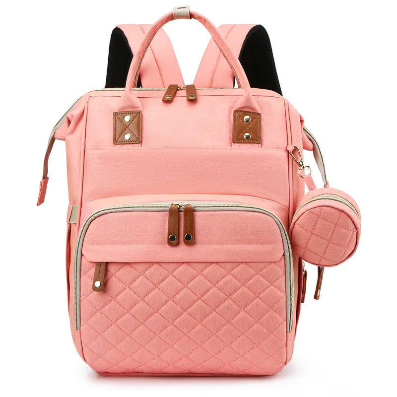 Organiza todo para tu bebé con la Mochila Pañalera Linden™: cambiador plegable, bolsillos térmicos, gran capacidad, separación húmedo/seco y diseño resistente al agua.