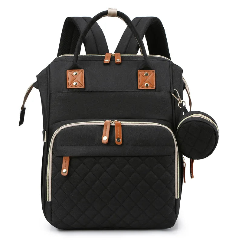 Organiza todo para tu bebé con la Mochila Pañalera Linden™: cambiador plegable, bolsillos térmicos, gran capacidad, separación húmedo/seco y diseño resistente al agua.