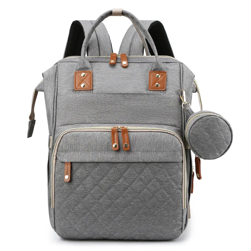 Organiza todo para tu bebé con la Mochila Pañalera Linden™: cambiador plegable, bolsillos térmicos, gran capacidad, separación húmedo/seco y diseño resistente al agua.