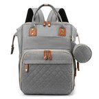 Organiza todo para tu bebé con la Mochila Pañalera Linden™: cambiador plegable, bolsillos térmicos, gran capacidad, separación húmedo/seco y diseño resistente al agua.
