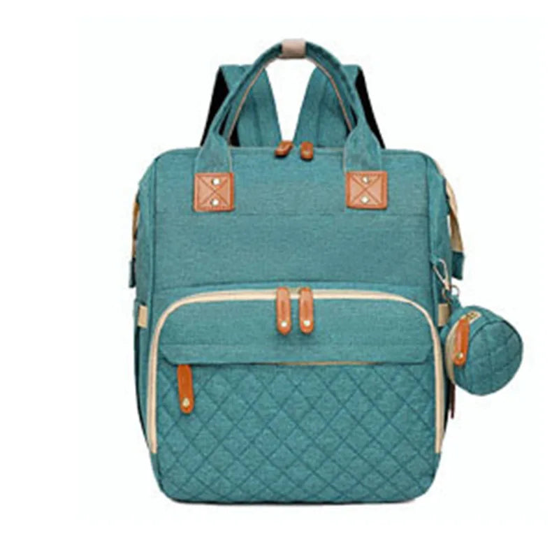 Organiza todo para tu bebé con la Mochila Pañalera Linden™: cambiador plegable, bolsillos térmicos, gran capacidad, separación húmedo/seco y diseño resistente al agua.